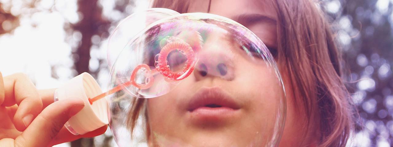 a-girl-is-blowing-bubbles